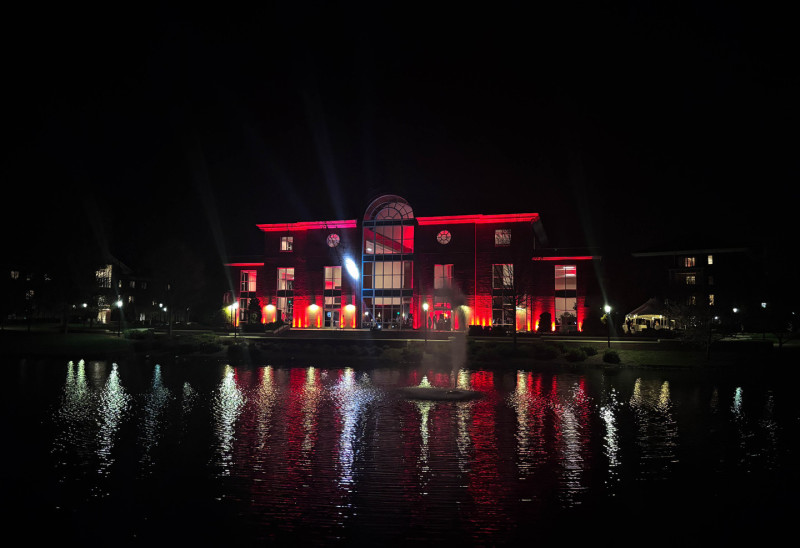 Uplighting a building at Elon University